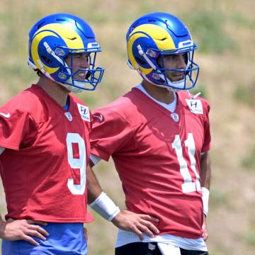 May 28, 2024; Thousand Oaks, CA, USA; Los Angeles Rams quarterbacks Matthew Stafford (9) and Jimmy Garoppolo (11) look on during OTAs at the team training facility at California Lutheran University. Mandatory Credit: Jayne Kamin-Oncea-USA TODAY Sports