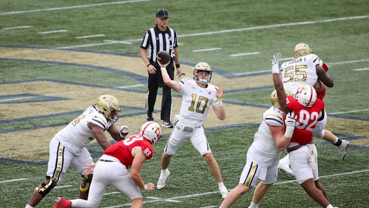 Sep 14, 2024; Atlanta, Georgia, USA; Georgia Tech Yellow Jackets quarterback Haynes King (10) throws a touchdown pass against the Virginia Military Institute Keydets in the second quarter at Bobby Dodd Stadium at Hyundai Field. Mandatory Credit: Brett Davis-Imagn Images