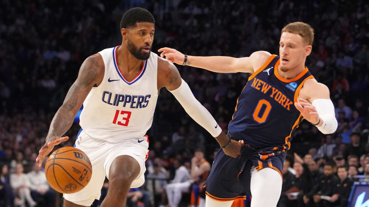 Nov 6, 2023; New York, New York, USA; Los Angeles Clipper forward Paul George (13) dribbles the ball against New York Knicks shooting guard Donte DiVincenzo (0) during the fourth quarter at Madison Square Garden. Mandatory Credit: Gregory Fisher-USA TODAY Sports