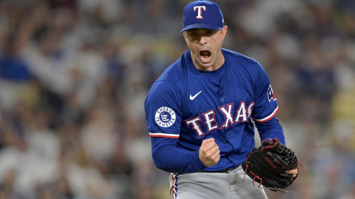 Jun 13, 2024; Los Angeles, California, USA;  Texas Rangers relief pitcher David Robertson (37) reacts after striking out Los Angeles Dodgers shortstop Mookie Betts (50), designated hitter Shohei Ohtani (17) and first baseman Freddie Freeman (5) in the eighth inning at Dodger Stadium. Mandatory Credit: Jayne Kamin-Oncea-USA TODAY Sports