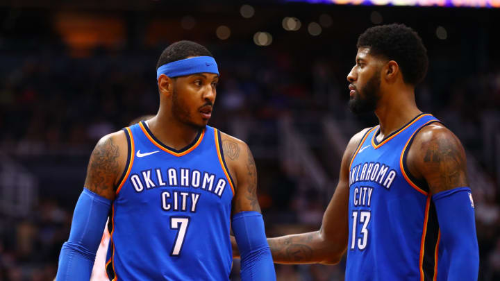 Mar 2, 2018; Phoenix, AZ, USA; Oklahoma City Thunder forward Carmelo Anthony (7) and forward Paul George (13) against the Phoenix Suns at Talking Stick Resort Arena. Mandatory Credit: Mark J. Rebilas-USA TODAY Sports