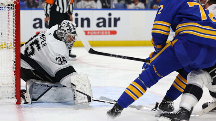 Oct 10, 2024; Buffalo, New York, USA;  Los Angeles Kings goaltender Darcy Kuemper (35) makes a stick save during the second period against the Buffalo Sabres at KeyBank Center. Mandatory Credit: Timothy T. Ludwig-Imagn Images