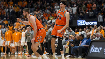 Dec 6, 2025; Nashville, Tennessee, USA;  Illinois Fighting Illini center Tomislav Ivisic (13) and center Zvonimir Ivisic (44) celebrate as Tennessee Volunteers calls timeout during the first half at Bridgestone Arena. Mandatory Credit: Steve Roberts-Imagn Images