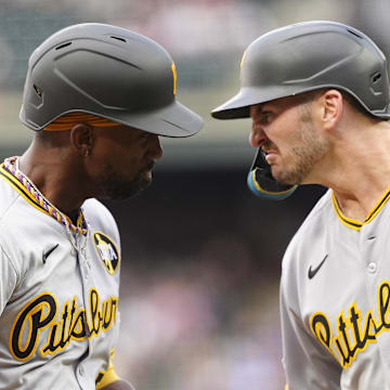 Aug 1, 2025; Denver, Colorado, USA; Pittsburgh Pirates designated hitter Andrew McCutchen (22) celebrates his three run home run with first baseman Spencer Horwitz (2) in the first inning against the Colorado Rockies at Coors Field. Mandatory Credit: Ron Chenoy-Imagn Images