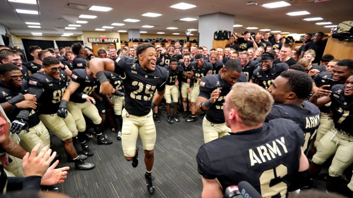 Aug 30, 2024; West Point, New York, USA; Army Black Knights defensive back Josiah Banks (25) celebrates with his teammates in the locker room after a  win against the Lehigh Mountain Hawks at Michie Stadium. Mandatory Credit: Danny Wild-USA TODAY Sports