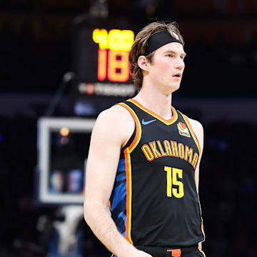 Dec 29, 2024; Oklahoma City, Oklahoma, USA; Oklahoma City Thunder center Branden Carlson (15) walks down the court during a fourth-quarter timeout against the Memphis Grizzlies at Paycom Center. Mandatory Credit: Alonzo Adams-Imagn Images