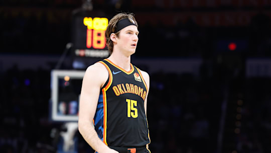 Dec 29, 2024; Oklahoma City, Oklahoma, USA; Oklahoma City Thunder center Branden Carlson (15) walks down the court during a fourth-quarter timeout against the Memphis Grizzlies at Paycom Center. Mandatory Credit: Alonzo Adams-Imagn Images
