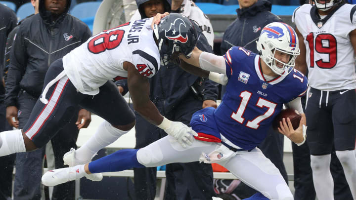 Bills quarterback Josh Allen is tackled by Texans Joe Thomas but not after gaining a first down