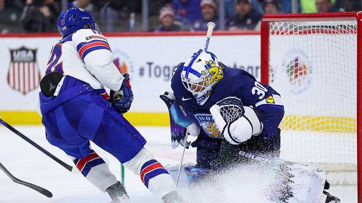 Jan 2, 2026; St. Paul, Minnesota, UNITED STATES; Finland goalie Petteri Rimpinen (30) defends his net as United States forward Will Zellers (12) shoots the puck during the third period in the quarterfinals of the 2026 IIHF World Junior Championship at Grand Casino Arena. Mandatory Credit: Matt Krohn-Imagn Images