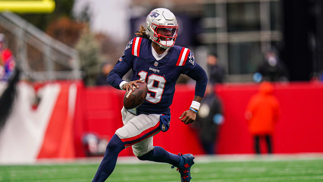 Jan 5, 2025; Foxborough, Massachusetts, USA; New England Patriots quarterback Joe Milton III (19) runs the ball against the Buffalo Bills in the first half at Gillette Stadium. Mandatory Credit: David Butler II-Imagn Images