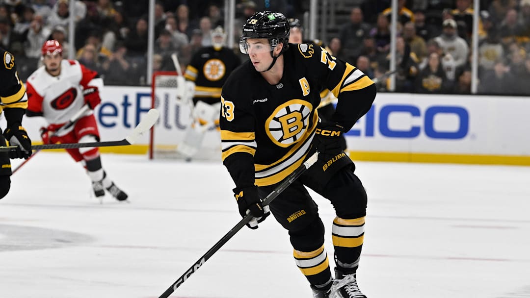 Nov 1, 2025; Boston, Massachusetts, USA; Boston Bruins defenseman Charlie McAvoy (73) skates with the puck during the third period against the Carolina Hurricanes at TD Garden. Mandatory Credit: Eric Canha-Imagn Images