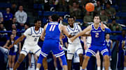 Boise State guard Alvaro Cardenas passes the ball to forward Tyson Degenhart.