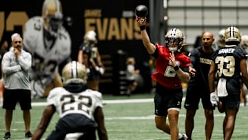 Quarterback Spencer Rattler (2) makes a throw during New Orleans Saints OTAs