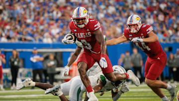 Aug 29, 2025; Lawrence, Kansas, USA; Kansas Jayhawks running back Daniel Hishaw Jr. (9) runs the ball during the second half against the Wagner Seahawks at David Booth Kansas Memorial Stadium. Mandatory Credit: William Purnell-Imagn Images