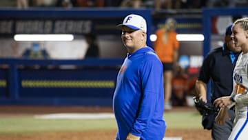 May 30, 2024; Oklahoma City, OK, USA;  Florida Gators head coach Tim Walton smiles towards his team coming off the field in the fourth inning against the Oklahoma St. Cowgirls during a Women's College World Series softball game at Devon Park. Mandatory Credit: Brett Rojo-Imagn Images