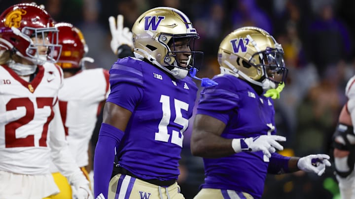 Nov 2, 2024; Seattle, Washington, USA; Washington Huskies wide receiver Keith Reynolds (15) celebrates after rushing for a touchdown against the USC Trojans during the fourth quarter at Alaska Airlines Field at Husky Stadium. Mandatory Credit: Joe Nicholson-Imagn Images