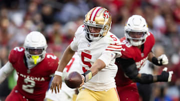 Jan 5, 2025; Glendale, Arizona, USA; San Francisco 49ers quarterback Joshua Dobbs (5) against the Arizona Cardinals at State Farm Stadium. Mandatory Credit: Mark J. Rebilas-Imagn Images