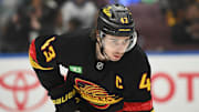 Apr 5, 2025; Vancouver, British Columbia, CAN;  Vancouver Canucks defenseman Quinn Hughes (43) awaits the start of play  against the Anaheim Ducks during the first period at Rogers Arena. Mandatory Credit: Anne-Marie Sorvin-Imagn Images