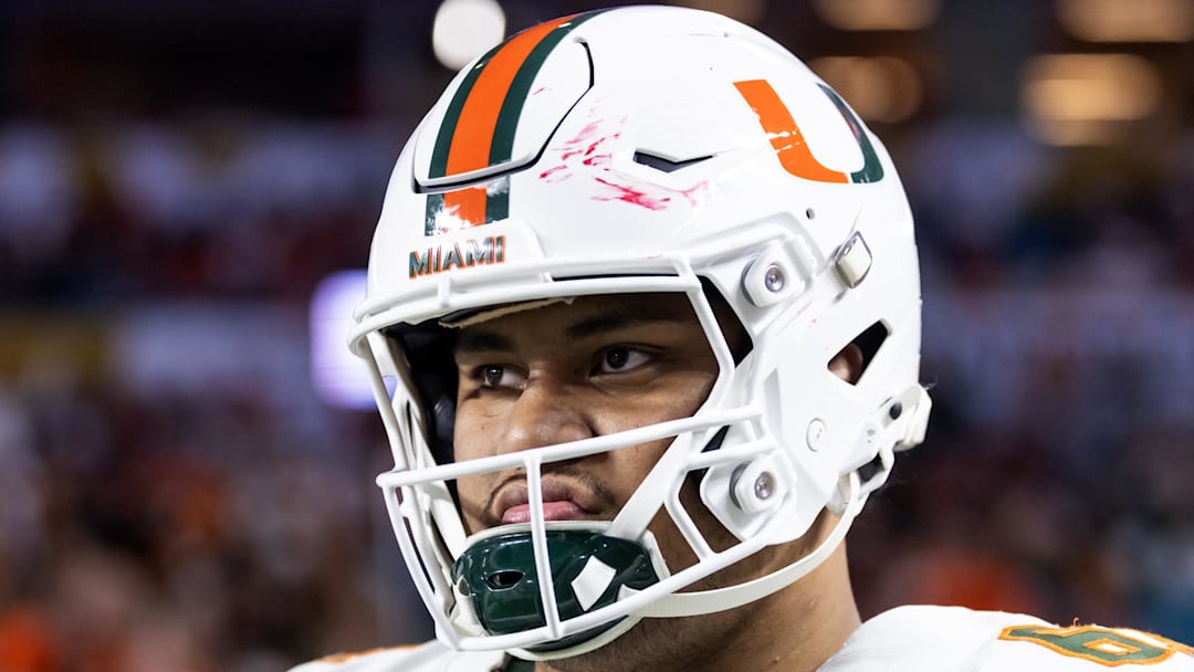 Jan 19, 2026; Miami Gardens, FL, USA; Miami Hurricanes offensive lineman Francis Mauigoa (61) against the Indiana Hoosiers during the College Football Playoff National Championship game at Hard Rock Stadium. Mandatory Credit: Mark J. Rebilas-Imagn Images