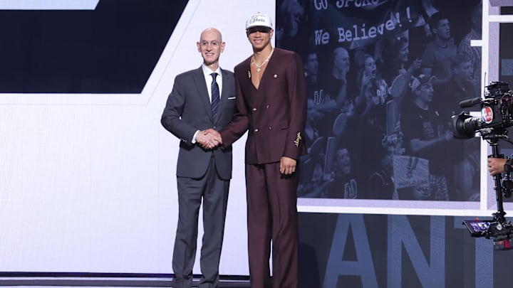 Jun 25, 2025; Brooklyn, NY, USA;  Carter Bryant stands with NBA commissioner Adam Silver after being selected as the 14th pick by the San Antonio Spurs in the first round of the 2025 NBA Draft at Barclays Center.