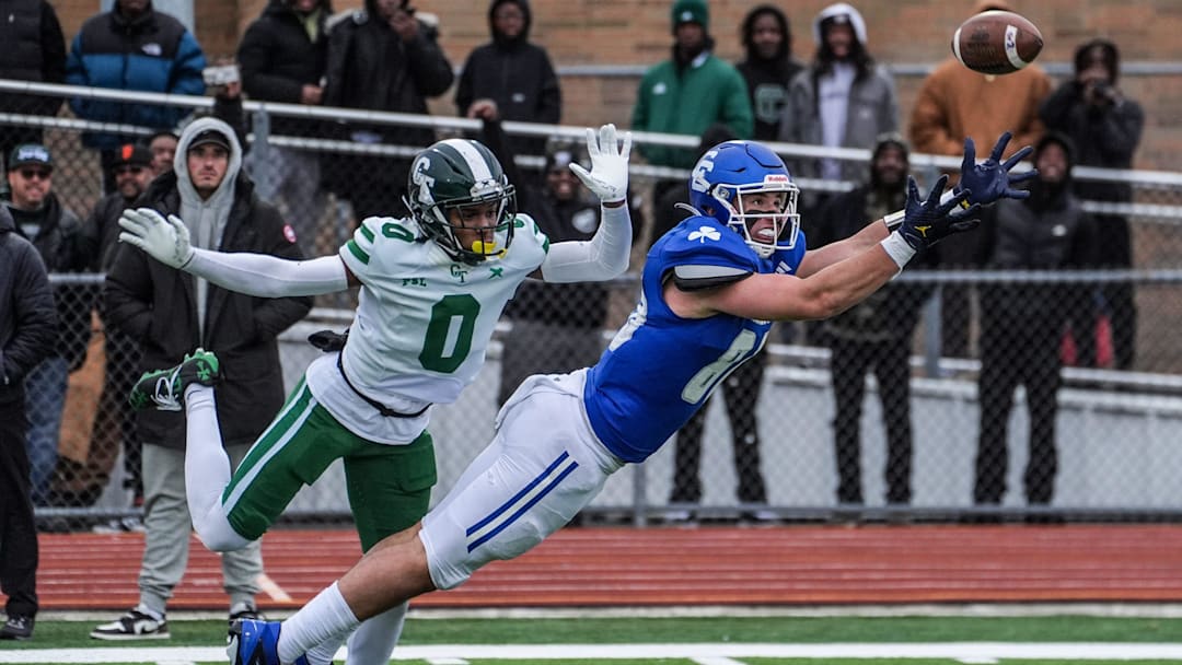 Novi Detroit Catholic Central's Jack Janda stretches out but fails to pull in the pass while covered by Detroit Cass Tech's Lamont Wilcoxson in the fourth quarter during the MHSAA Division 1 semifinals at Troy Athens High School on Saturday, Nov. 23, 2024.