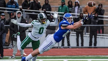 Novi Detroit Catholic Central‘s Jack Janda stretches out but fails to pull in the pass while being covered by Cass Tech’s Lamont Wilcoxson in the fourth quarter during the MHSAA semifinals of the state playoffs at Troy Athens High School on Saturday, Nov. 23, 2024.
