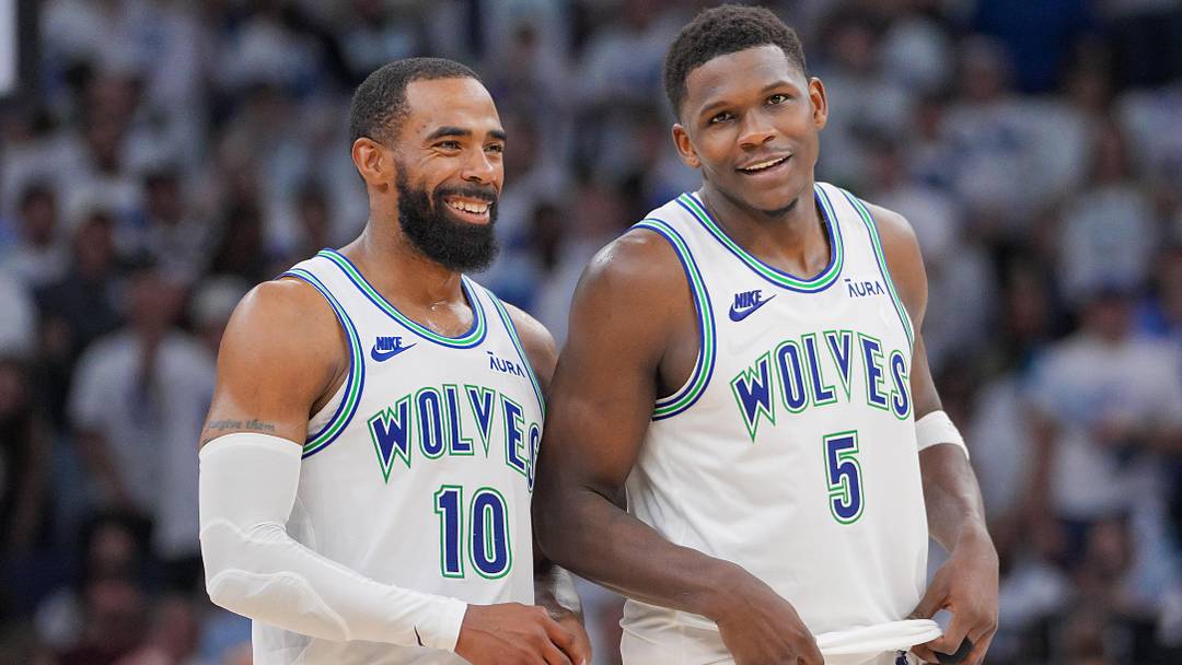 May 16, 2024; Minneapolis, Minnesota, USA; Minnesota Timberwolves guard Mike Conley (10) and guard Anthony Edwards (5) talk against the Denver Nuggets in the fourth quarter during game six of the second round for the 2024 NBA playoffs at Target Center. 