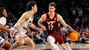 Dec 2, 2025; Columbia, S.C.; Virginia Tech guard Neoklis Avdalas (17) drives around South Carolina guard Mike Sharavjamts (55).