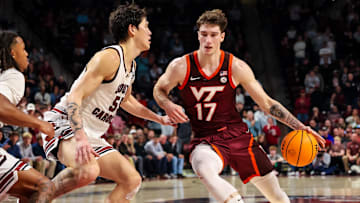 Dec 2, 2025; Columbia, S.C.; Virginia Tech guard Neoklis Avdalas (17) drives around South Carolina guard Mike Sharavjamts (55).