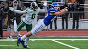 Wisconsin Badgers commit Jack Janda of Novi Detroit Catholic Central stretches out but fails to pull in the pass while covered by Detroit Cass Tech's Lamont Wilcoxson in the fourth quarter during the MHSAA Division 1 semifinals at Troy Athens High School on Saturday, Nov. 23, 2024.