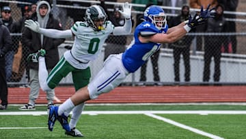 Wisconsin Badgers commit Jack Janda of Novi Detroit Catholic Central stretches out but fails to pull in the pass while covered by Detroit Cass Tech's Lamont Wilcoxson in the fourth quarter during the MHSAA Division 1 semifinals at Troy Athens High School on Saturday, Nov. 23, 2024.