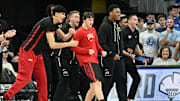 The UNLV Rebels bench cheer action against the Creighton Bluejays in the first half at CHI Health Center Omaha. 