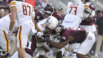 Sep 16, 2023; College Station, Texas, USA; Texas A&M Aggies defensive lineman McKinnley Jackson (3) and defensive lineman Shemar Turner (5) tackle Louisiana Monroe Warhawks running back Isaiah Woullard (22) during the third quarter at Kyle Field. Mandatory Credit: Troy Taormina-USA TODAY Sports