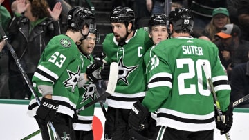 Mar 20, 2024; Dallas, Texas, USA; Dallas Stars center Wyatt Johnston (53) and center Logan Stankoven (11) and left wing Jamie Benn (14) and defenseman Nils Lundkvist (5) and defenseman Ryan Suter (20) celebrates a goal scored by Benn against the Arizona Coyotes during the second period at the American Airlines Center. Mandatory Credit: Jerome Miron-USA TODAY Sports