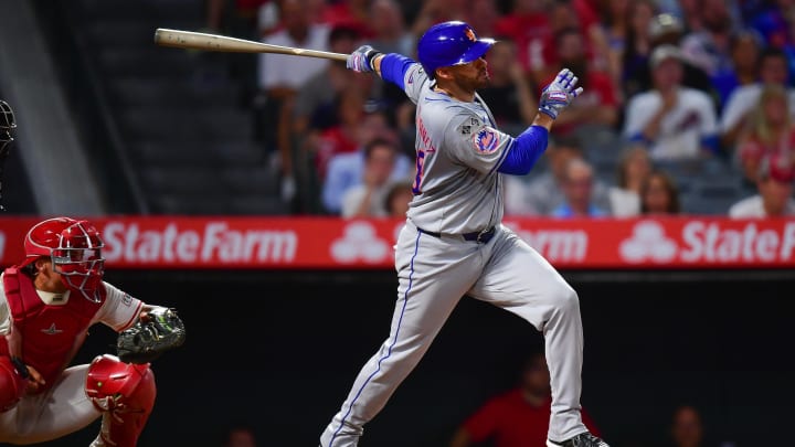 August 3, 2024; Anaheim, California, USA; New York Mets designated hitter J.D. Martinez (28) hits a grand slam home run against the Los Angeles Angels during the seventh inning at Angel Stadium. Mandatory Credit: Gary A. Vasquez-USA TODAY Sports