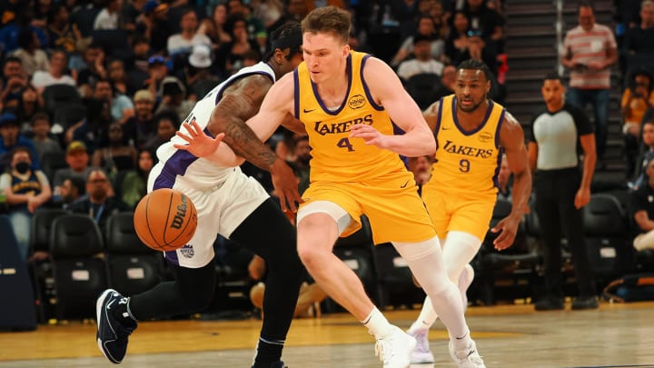 Jul 6, 2024; San Francisco, CA, USA; Los Angeles Lakers guard Dalton Knecht (4) steals the ball against Sacramento Kings guard Kenan Blacksheard (37) during the fourth quarter at Chase Center. Mandatory Credit: Kelley L Cox-USA TODAY Sports