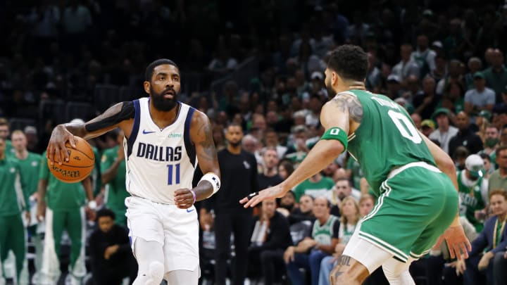 Jun 17, 2024; Boston, Massachusetts, USA; Dallas Mavericks guard Kyrie Irving (11) dribbles the ball against Boston Celtics forward Jayson Tatum (0) during the second quarter in game five of the 2024 NBA Finals at TD Garden. Mandatory Credit: Peter Casey-USA TODAY Sports