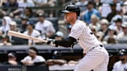 Jun 21, 2025; Bronx, New York, USA; New York Yankees outfielder Cody Bellinger (35) hits a single against the Baltimore Orioles during the first inning at Yankee Stadium. Mandatory Credit: John Jones-Imagn Images