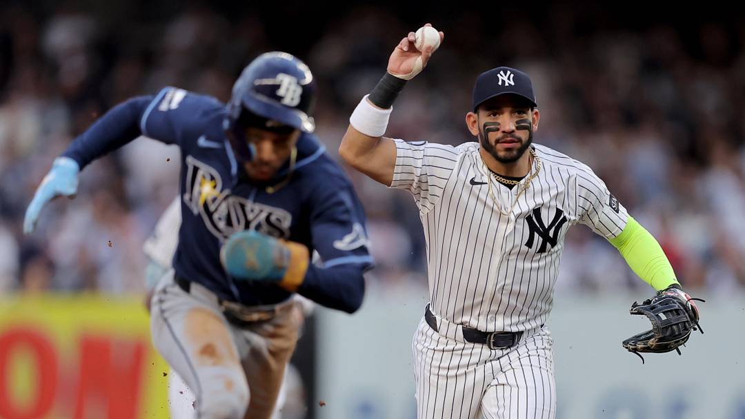 May 22, 2026; Bronx, New York, USA; Tampa Bay Rays left fielder Chandler Simpson (14) runs to third during a rundown after being picked off at second base as New York Yankees shortstop Jose Caballero (72) chases during the first inning at Yankee Stadium. Mandatory Credit: Brad Penner-Imagn Images May 22, 2026; Bronx, New York, USA; Tampa Bay Rays left fielder Chandler Simpson (14) runs to third during a rundown after being picked off at second base as New York Yankees shortstop Jose Caballero (72) chases during the first inning at Yankee Stadium. Mandatory Credit: Brad Penner-Imagn Images