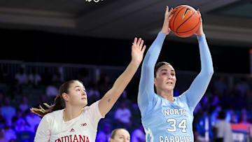 Nov 25, 2024; Paradise Island, Bahamas, BHS; North Carolina Tar Heels center Blanca Thomas (34) grabs the ball away from Indiana Hoosiers forward Lilly Meister (52) during the first half at the Atlantis Resort. Mandatory Credit: Kevin Jairaj-Imagn Images