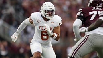 Texas Longhorns linebacker Trey Moore attempts to get into the backfield during the second quarter against the Mississippi State Bulldogs at Davis Wade Stadium at Scott Field.