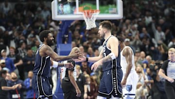 Dec 3, 2024; Dallas, Texas, USA;  Dallas Mavericks guard Kyrie Irving (11) celebrates with Dallas Mavericks guard Luka Doncic (77) during the fourth quarter against the Memphis Grizzlies at American Airlines Center. Mandatory Credit: Kevin Jairaj-Imagn Images