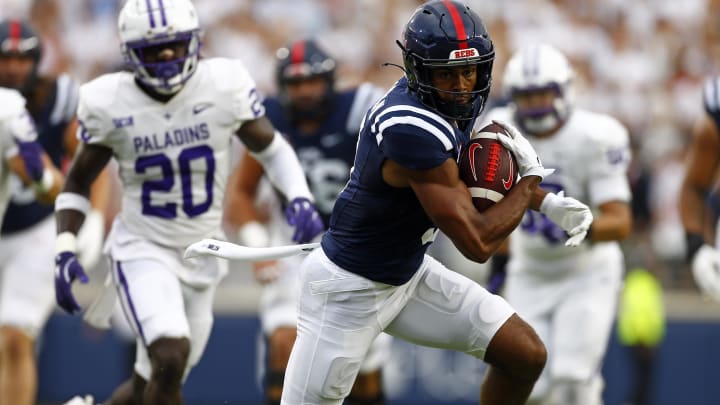 Aug 31, 2024; Oxford, Mississippi, USA; Mississippi Rebels wide receiver Tre Harris (9) runs after a catch against the Furman Paladins during the first quarter at Vaught-Hemingway Stadium. Mandatory Credit: Petre Thomas-USA TODAY Sports