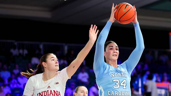 Nov 25, 2024; Paradise Island, Bahamas, BHS; North Carolina Tar Heels center Blanca Thomas (34) grabs the ball away from Indiana Hoosiers forward Lilly Meister (52) during the first half at the Atlantis Resort. Mandatory Credit: Kevin Jairaj-Imagn Images