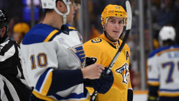 Apr 1, 2023; Nashville, Tennessee, USA; Nashville Predators defenseman Tyson Barrie (22) talks with St. Louis Blues center Brayden Schenn (10) after a play during the first period at Bridgestone Arena. Mandatory Credit: Christopher Hanewinckel-USA TODAY Sports