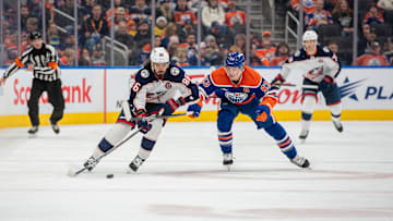 Blue Jackets winger Kirill Marchenko skates away from Edmonton Oilers center Ryan Nugent-Hopkins.