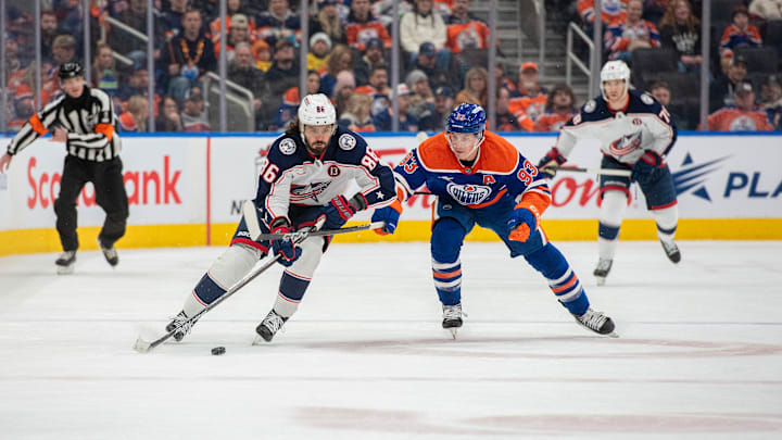 Blue Jackets winger Kirill Marchenko skates away from Edmonton Oilers center Ryan Nugent-Hopkins.