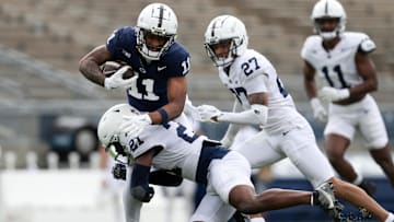 Penn State football wide receiver Kyron Hudson runs with the ball during the Blue White spring game at Beaver Stadium