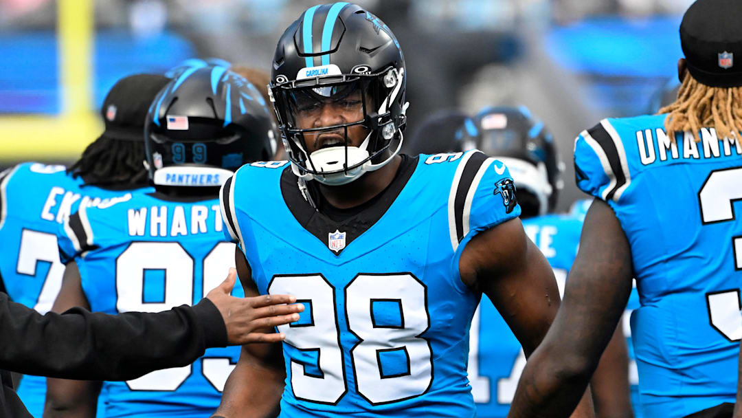 Oct 26, 2025; Charlotte, North Carolina, USA; Carolina Panthers linebacker D.J. Wonnum (98) runs on to the field before the game at Bank of America Stadium. Mandatory Credit: Bob Donnan-Imagn Images