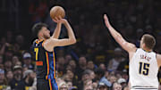 May 7, 2025; Oklahoma City, Oklahoma, USA; Oklahoma City Thunder forward Chet Holmgren (7) shoots a three point basket as Denver Nuggets center Nikola Jokic (15) defends in the first quarter during game two of the second round for the 2025 NBA Playoffs at Paycom Center. Mandatory Credit: Alonzo Adams-Imagn Images